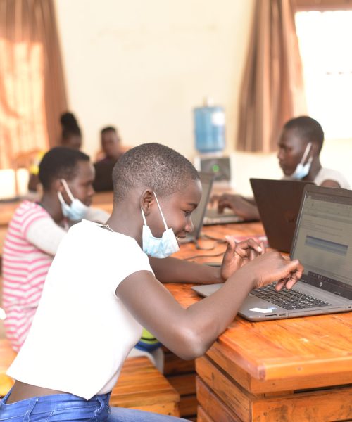 Students working on their ICT skills in the 2021 Tech Ed program in Gulu, Uganda.