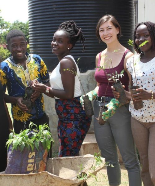 The 2018 environmental sustainability interns preparing the tree seedlings to plant at Negri College in Gulu, Uganda.